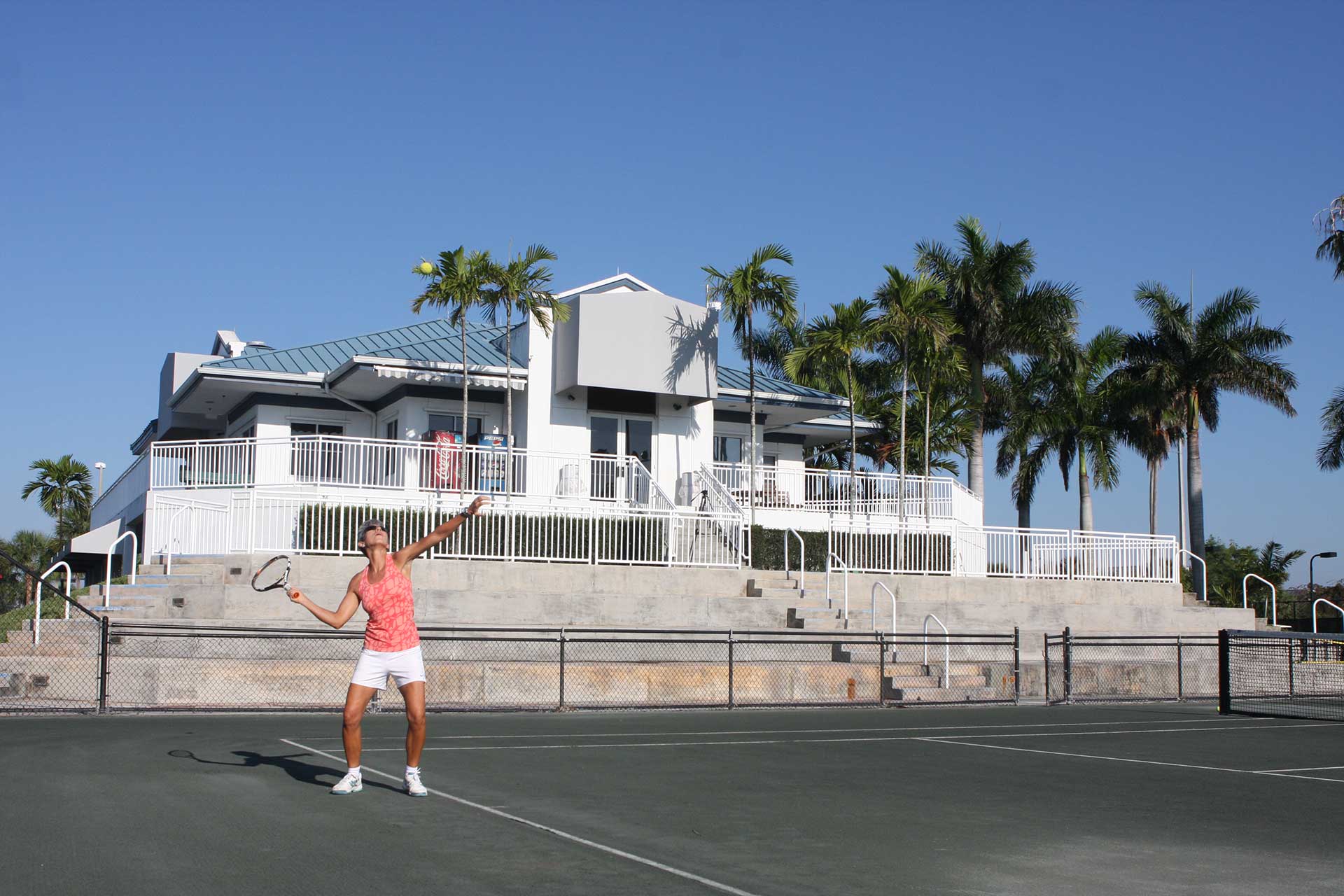 Tennis Center Club House and Court with Tennis Player